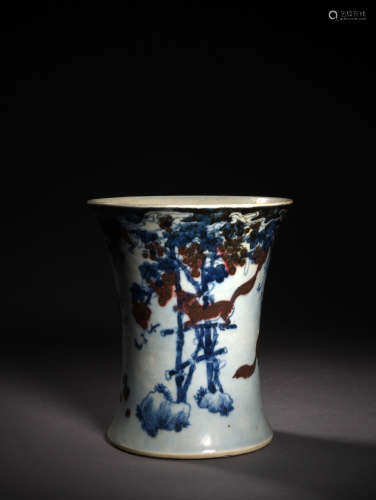 A BLUE AND WHTIE AND COPPER-RED SQUIRREL AND GRAPEVINE BRUSH POT, 17TH CENTURY