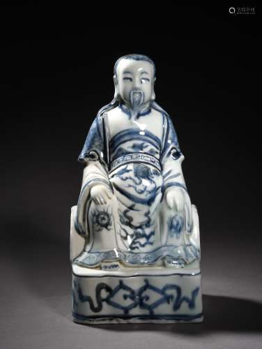 A BLUE AND WHITE SEATED FIGURE, 16TH CENTURY