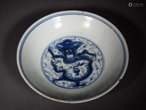 A BLUE AND WHITE DRAGON AND CLOUDS BOWL, 17TH CENTURY