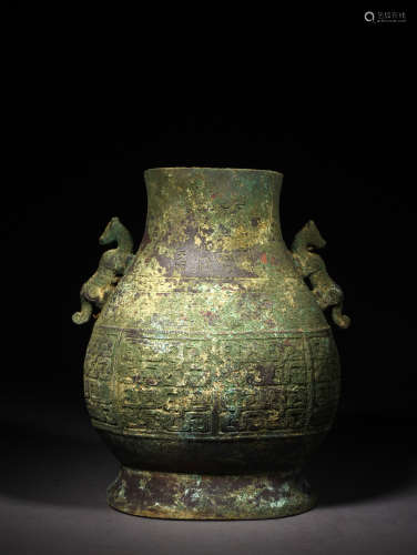 A BRONZE ARCHASTIC FORM ZUN VASE, POSSIBLY SHANG DYNASTY