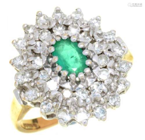 AN EMERALD AND DIAMOND RING the oval emerald 0.4ct approx, the brilliant cut diamonds 0.85ct approx,