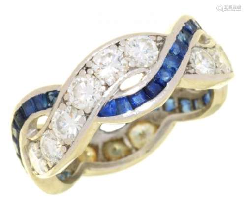A SAPPHIRE AND DIAMOND TWIST RING with calibre cut sapphires, in platinum, 6.5g, size M½++Complete