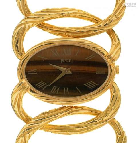 A PIAGET 18CT GOLD LADY'S WRISTWATCH Ref 9850 D 65, No 177273, with oval tiger's eye dial, maker's