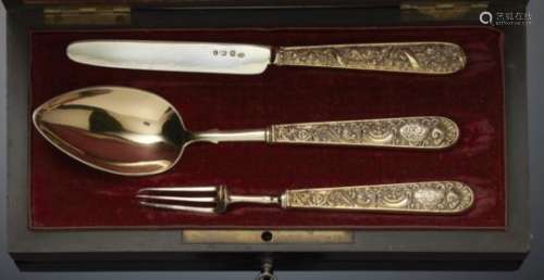 A GEORGE IV COMPOSED SILVER GILT CHRISTENING SET OF SPOON, FORK AND KNIFE with flower and shell