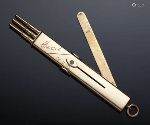 A 9CT GOLD AND ENAMEL RETRACTABLE PENCIL incorporating a letter opener, the three pencil slides with