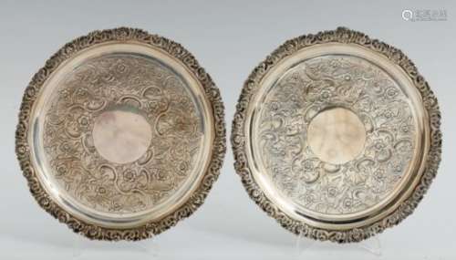 A PAIR OF GEORGE III SILVER WAITERS flat chased with a wide band of flowers and rocaille in