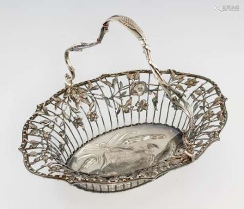 A GEORGE III SILVER BREAD BASKET the openwork swing handle applied with ears of wheat, the