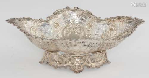 A VICTORIAN DIAPER PIERCED AND EMBOSSED SILVER FRUIT BOWL on openwork foot, 36.5cm l, by Mappin &
