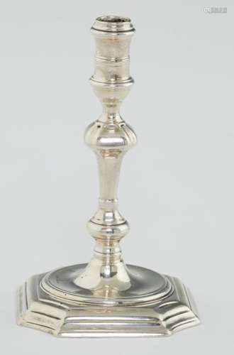 A GEORGE II SILVER TAPERSTICK with banded sconce, on moulded foot, engraved under the foot with