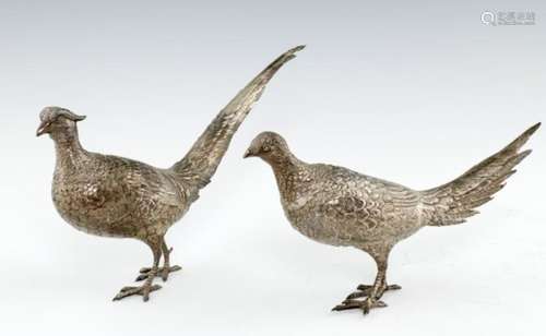 A PAIR OF GERMAN SILVER PHEASANT TABLE ORNAMENTS the head detachable, 30 and 36cm l, by Ludwig