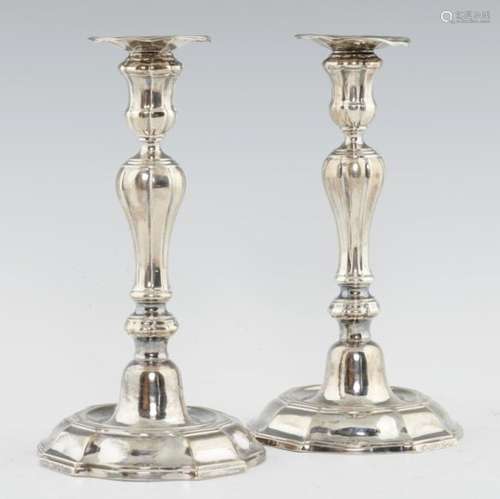 A PAIR OF AUSTRIAN NETHERLANDS SILVER CANDLESTICKS with inverted baluster knopped pillar, waisted