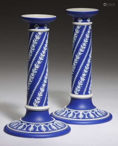 A PAIR OF WEDGWOOD DARK BLUE JASPER DIP CANDLESTICKS, C1870-90 ornamented with spiralling foliage,