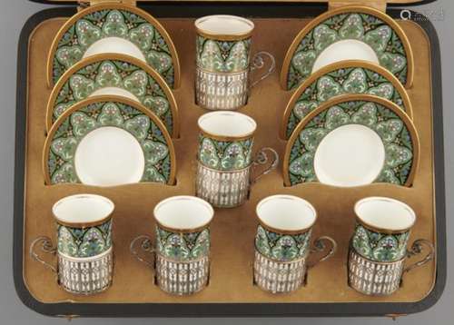 A SET OF SIX WEDGWOOD COFFEE CUPS AND SAUCERS, C1925 with pierced silver cup holders, saucer 12cm