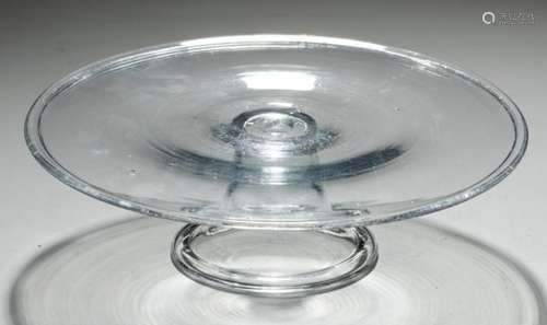 AN ENGLISH GLASS SALVER, C1740 on flared foot with folded rim, 22cm diam++Good condition