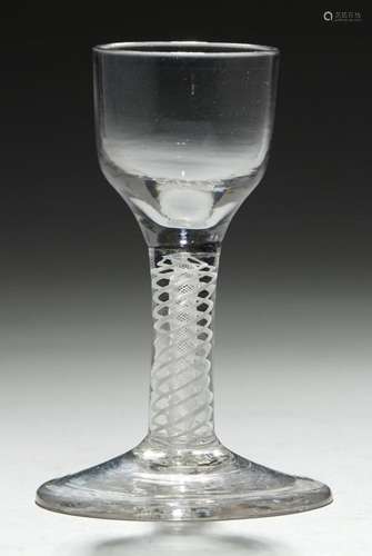 AN ENGLISH CORDIAL GLASS, C1770 the ogee bowl on double series opaque twist stem and conical foot,