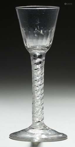 AN ENGLISH WINE GLASS, C1750 the fluted round funnel bowl on double series air twist stem and