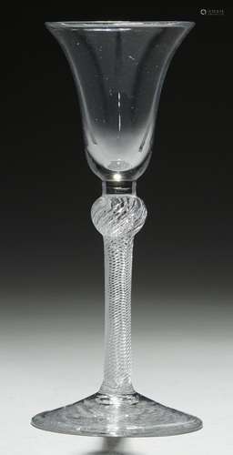 AN ENGLISH WINE GLASS, C1760 the bell bowl on composite stem with plain section above air twist