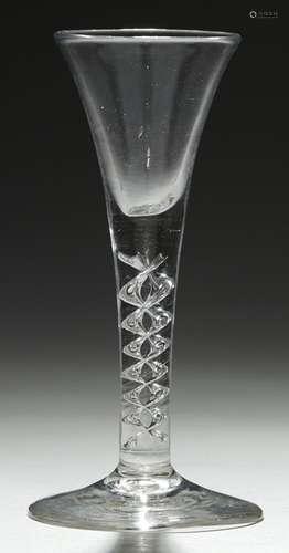 AN ENGLISH WINE GLASS, C1750 the drawn trumpet bowl with solid base on 'mercury' twist stem, conical