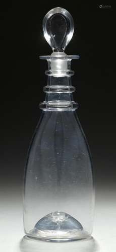 AN ENGLISH GLASS DECANTER, C1760 with three neck rings and kick-in base with pontil scar, stopper,