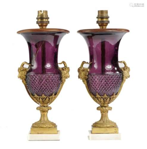 A PAIR OF ORMOLU MOUNTED AMETHYST GLASS VASES, EARLY 20TH C of campana shape with ram's head