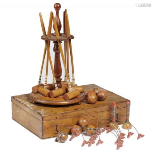 A VICTORIAN TABLE CROQUET GAME, LATE 19TH C of eight light wood mallets, hoops, balls and turned