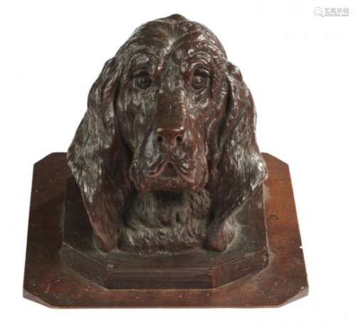 A WALNUT CARVING OF THE HEAD OF A DOG, LATE 19TH C possibly from a mirror or other frame and re-