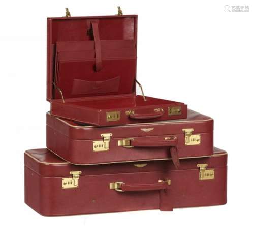 ASTON MARTIN. A SET OF RED LEATHER LUGGAGE TANNER KROLLE & CO LTD LONDON, C1990 comprising briefcase