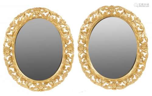 A PAIR OF EARLY VICTORIAN OVAL GILTWOOD MIRRORS, C1840 with ribbon surround and carved and pierced