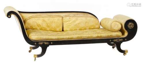 A GEORGE IV EBONISED COUCH with scroll back and end, retaining several gilt brass appliques, on