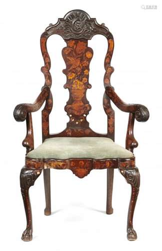 A DUTCH CARVED WALNUT AND MARQUETRY ARMCHAIR, 19TH C the outswept acanthus carved arms terminating