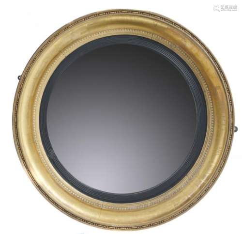 A REGENCY CIRCULAR GILTWOOD MIRROR, C1820-30 the convex plate in reeded ebonised slip and beaded