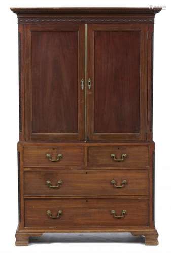 A GEORGE III MAHOGANY LINEN PRESS with blind fret carved tracery and dentil cornice above panelled