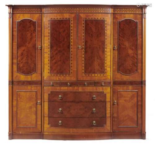 A BOW CENTRED MAHOGANY AND INLAID WARDROBE MAPLE & CO LONDON, C1910 with plum pudding figured