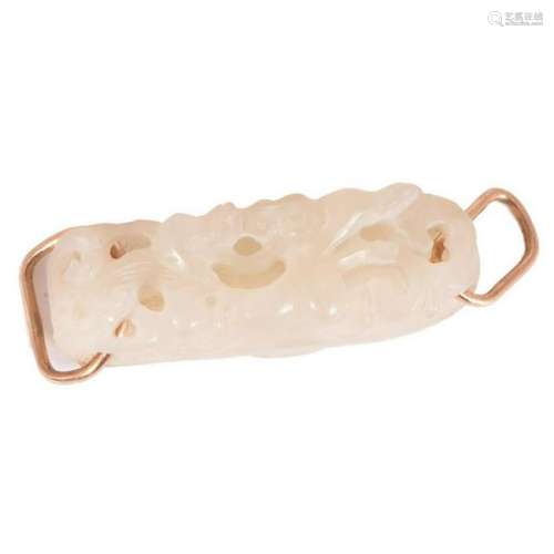 A Chinese carved jade belt buckle.