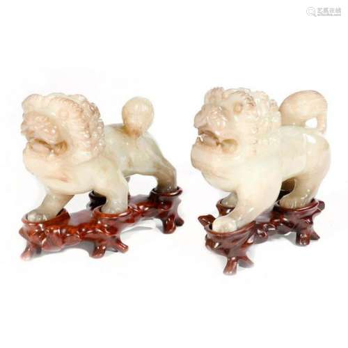 A pair of Chinese hard stone lions.