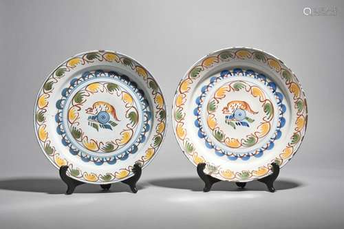 A pair of delftware polychrome chargers c.1730, po…