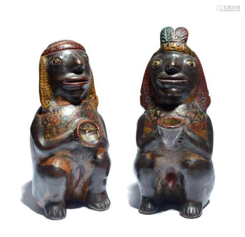 A pair of Peruvian figures pottery with polychrome…