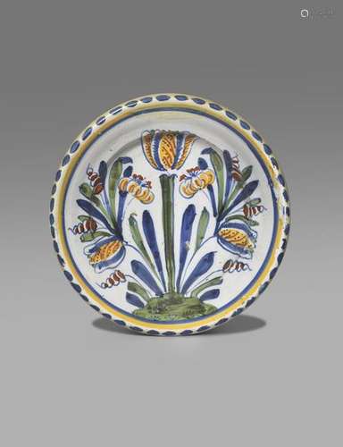 A Brislington blue dash tulip charger c.1720, bold…