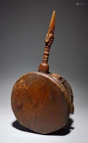 A Tibet shaman's drum with a carved handle includi…