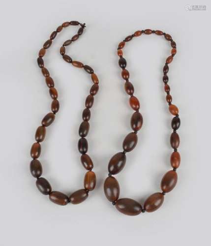 Two horn bead necklaces graduated, one with ovals …