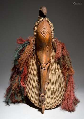 A Papua New Guinea mask Melanesia attached to a ba…