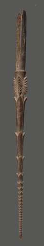 A Fiji spear tip Melanesia with carved barbs and a…