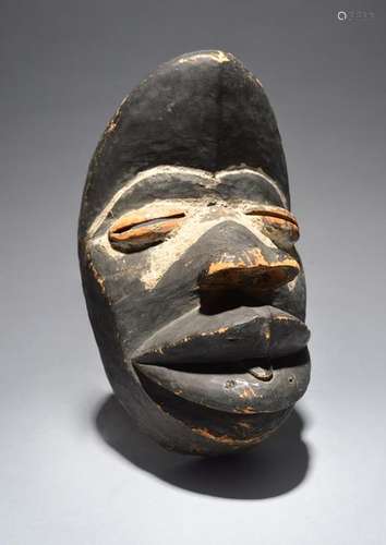 A Dan Wobe mask Liberia stained black and with whi…