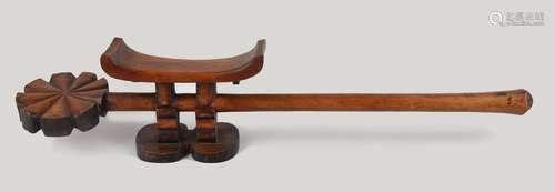 A Tsonga headrest Mozambique with a long handle an…