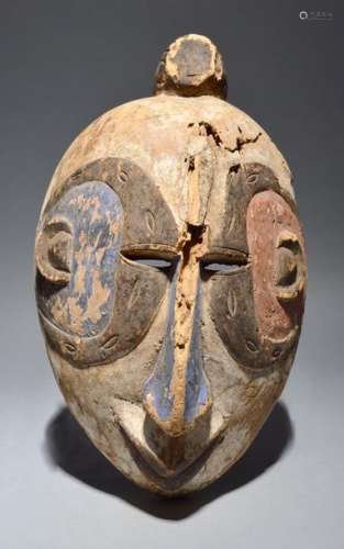 An Igbo mask Nigeria with polychrome decoration, 4…