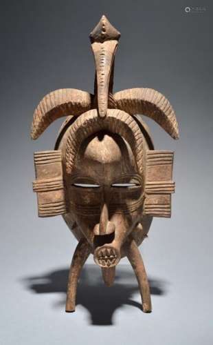 A Senufo kpelie mask Ivory Coast with a bird surmo…