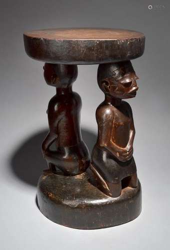 A Makonde double caryatid stool Mozambique with a …