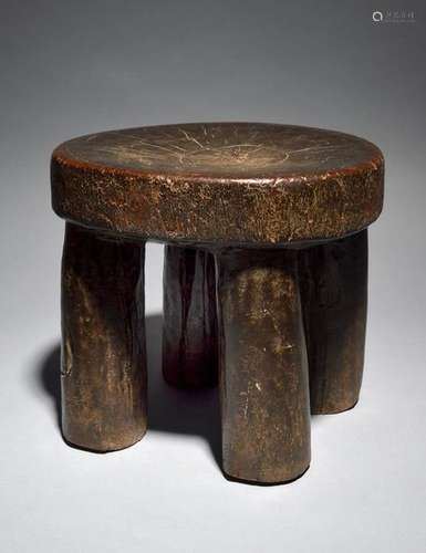 An East African stool with four column legs, 25.5c…