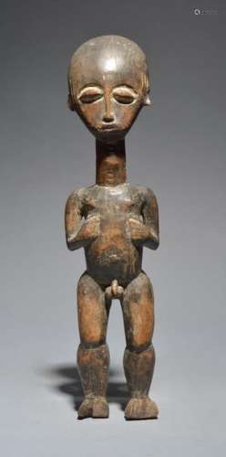 An Ashanti standing male figure Ghana with remains…