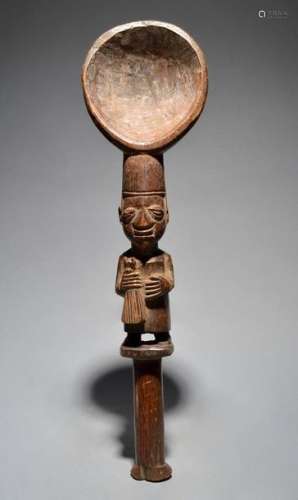 A Yoruba ceremonial spoon Nigeria with a male figu…